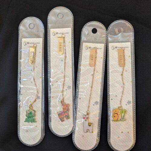 Product image of all the metal pendant bookmarks from characters series, that's sold by Plumbum Stationaries BD.