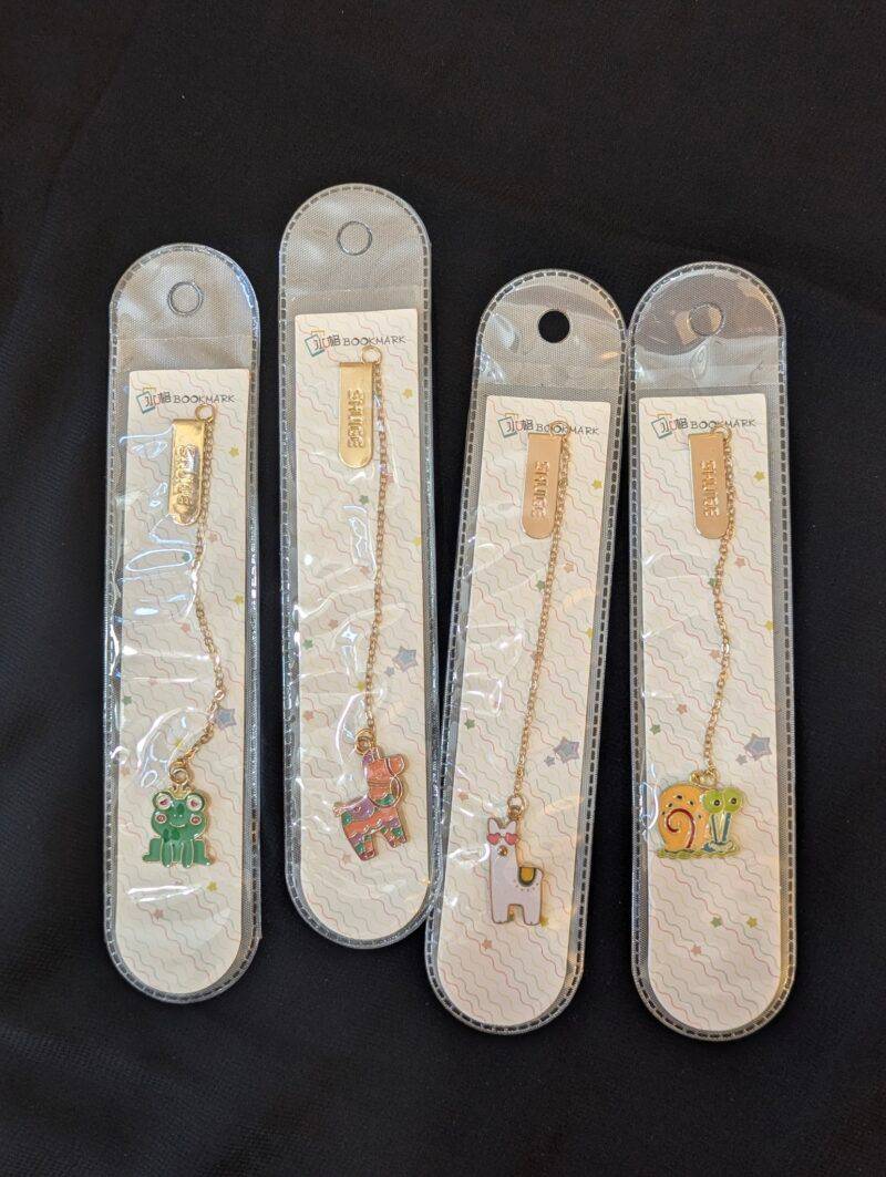 Product image of all the metal pendant bookmarks from characters series, that's sold by Plumbum Stationaries BD.